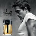 Image of Robert Pattinson with a bottle of perfume